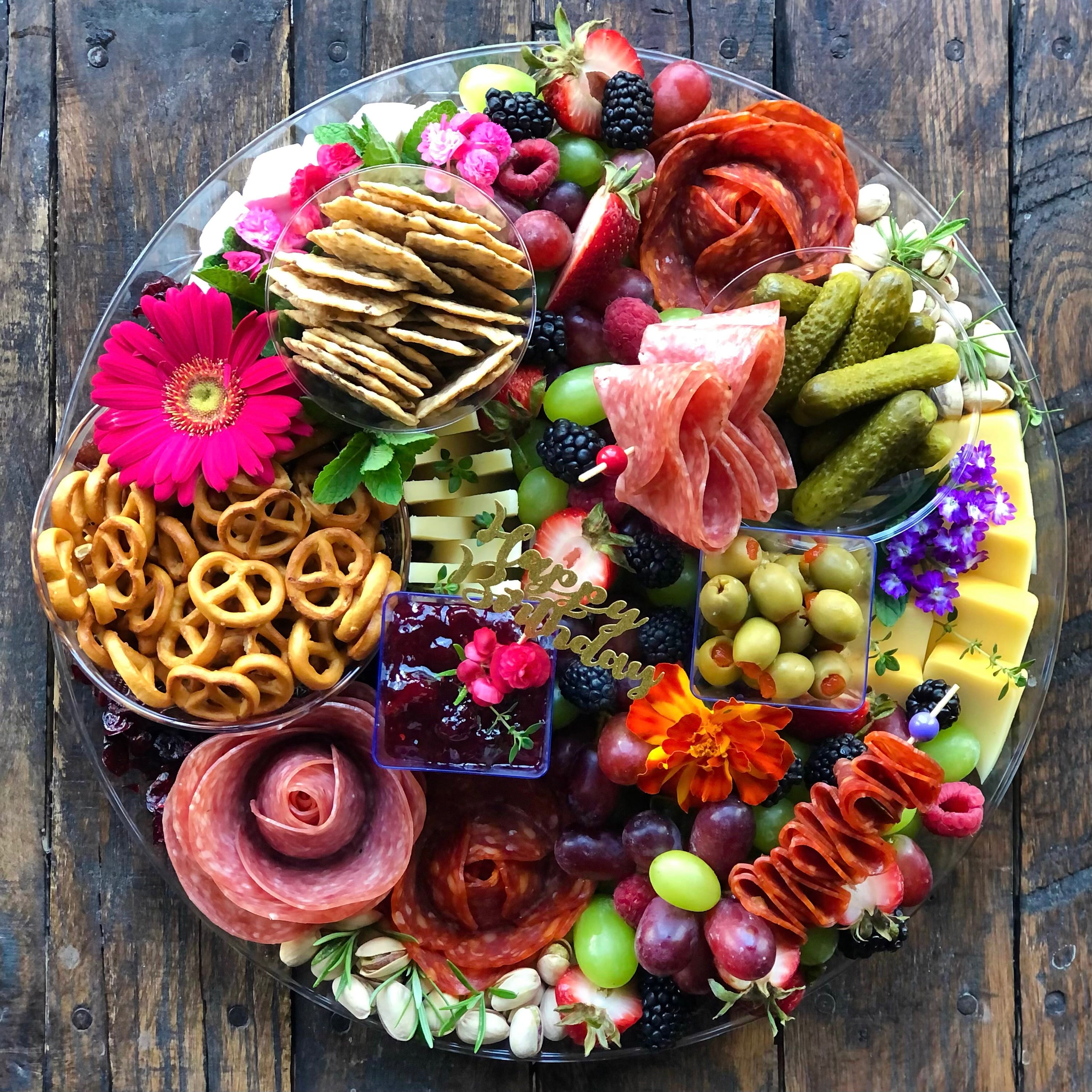 Charcuterie graze platter with meats, fruits, vegetables, cheese and crackers