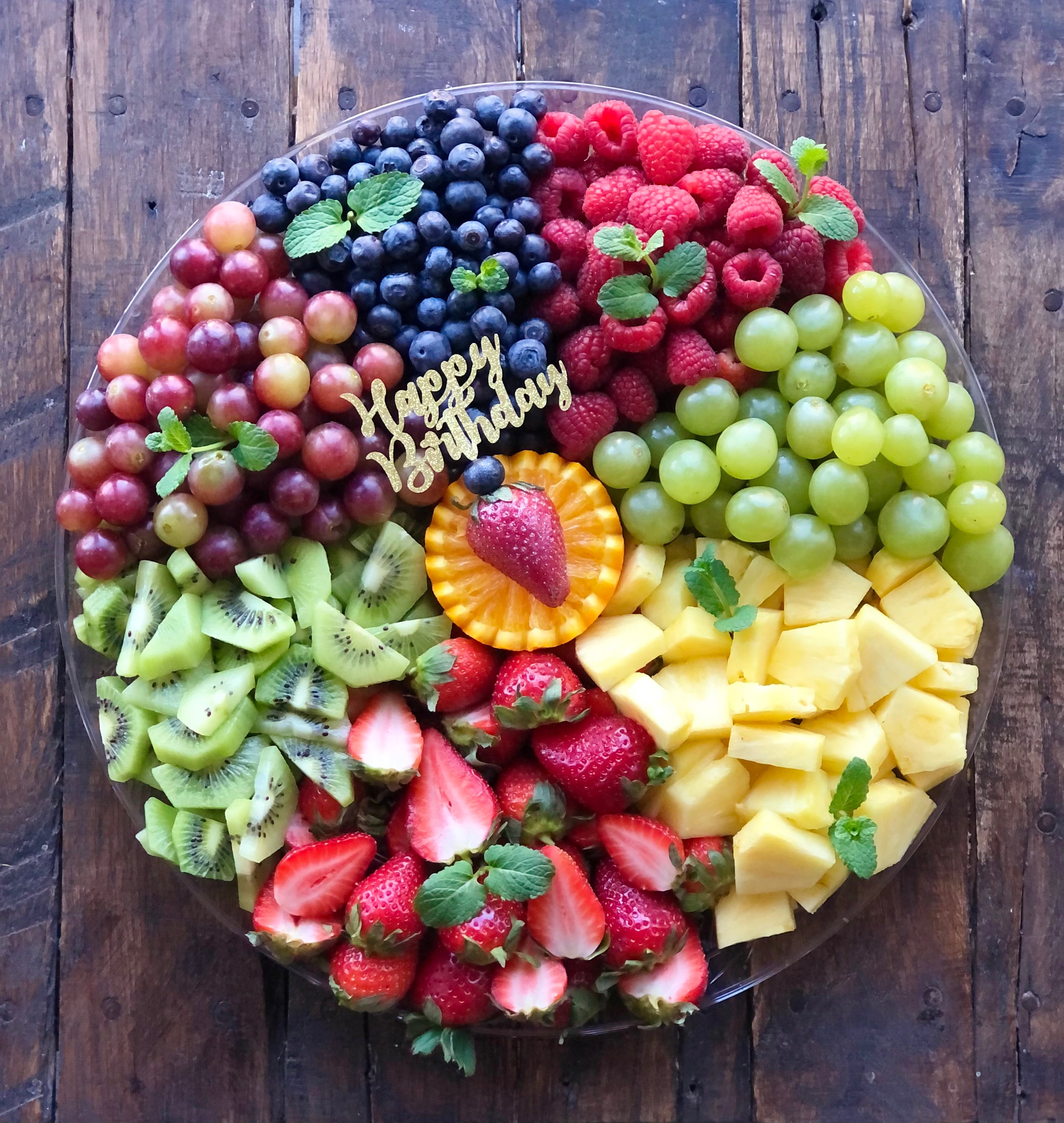 Fruit Graze platter with grapes, blueberries, raspberries, pineapple, strawberries, and kiwi
